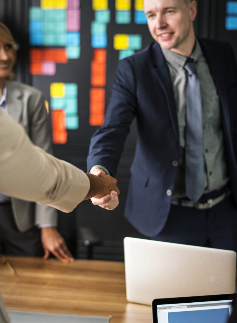 A confidential agreement being reached in a meeting room